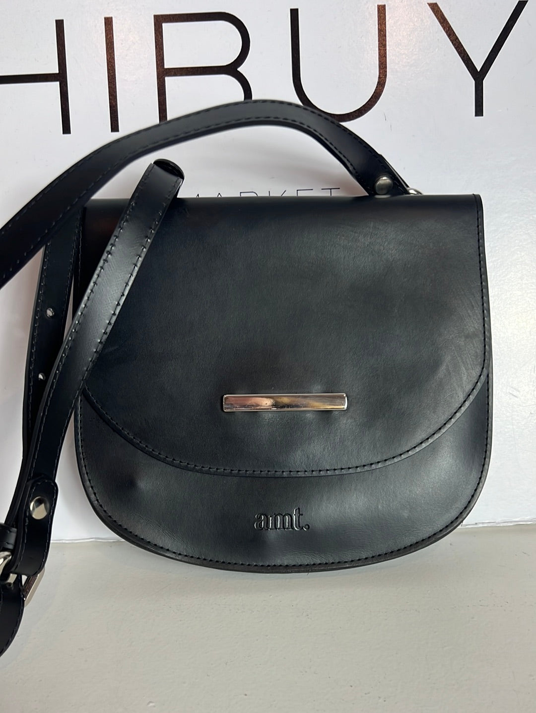 AMT. Flat black mini bag