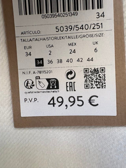 MASSIMO DUTTI. Denim recto blanco abotonado