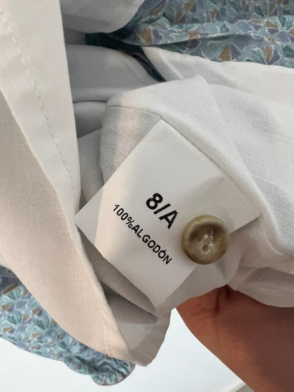 DOÑA CARMEN. Vestido estampado fondo azul claro. T 8 años