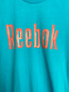 REEBOK. Camiseta azul logo T. XS