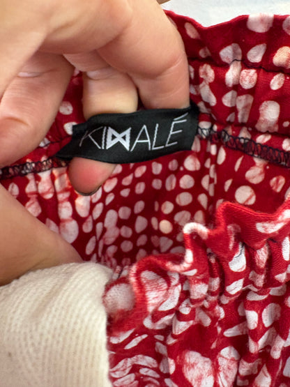 KIMALÉ. Conjunto falda y camisa roja estampada. T 36