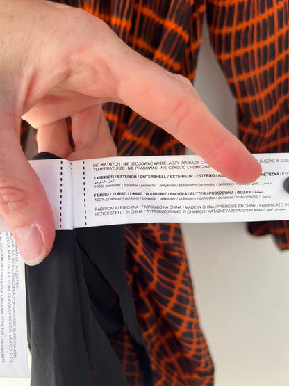 SFERA. Black and orange pleated dress TM