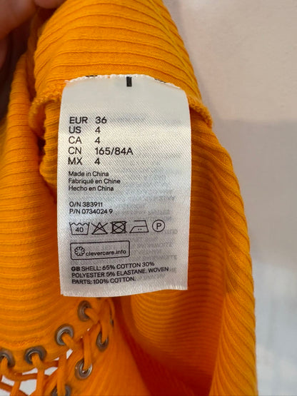 H&M STUDIO. Top naranja cuerdas