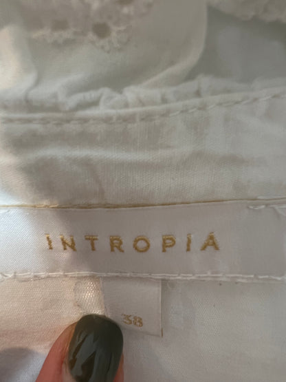 INTROPIA. White blouse with die-cut ruffles, size 38