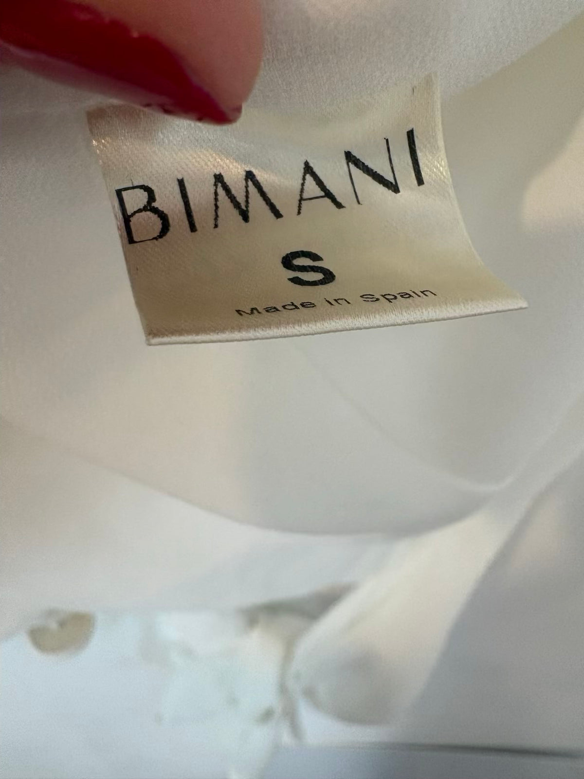 BIMANI. Blusa blanca fluida cruzada