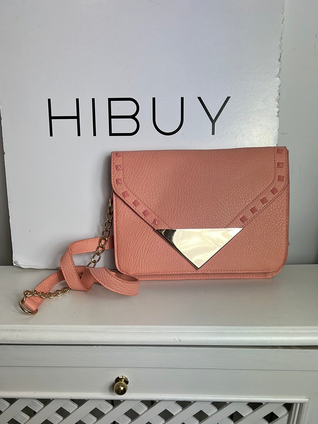 WHITE. Pink studded bag