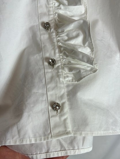 OTRAS. Blusa blanca volante y botones pedrería. T S