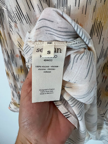SESSÚN. Total look beige estampado T.s