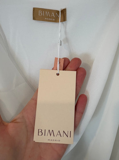 BIMANI. Blusa blanca escote fluido