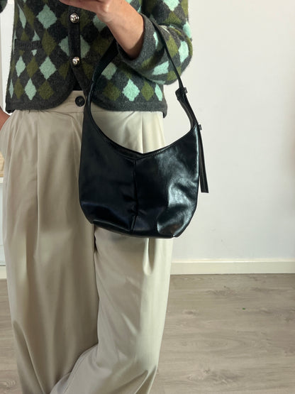 LEFTIES. Black faux leather bag