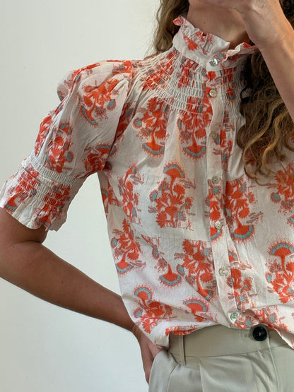 OTRAS. Blusa estampada nido de abeja