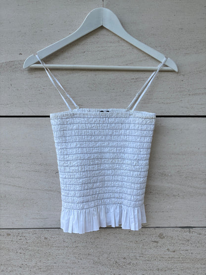 H&M. Top blanco nido de abeja