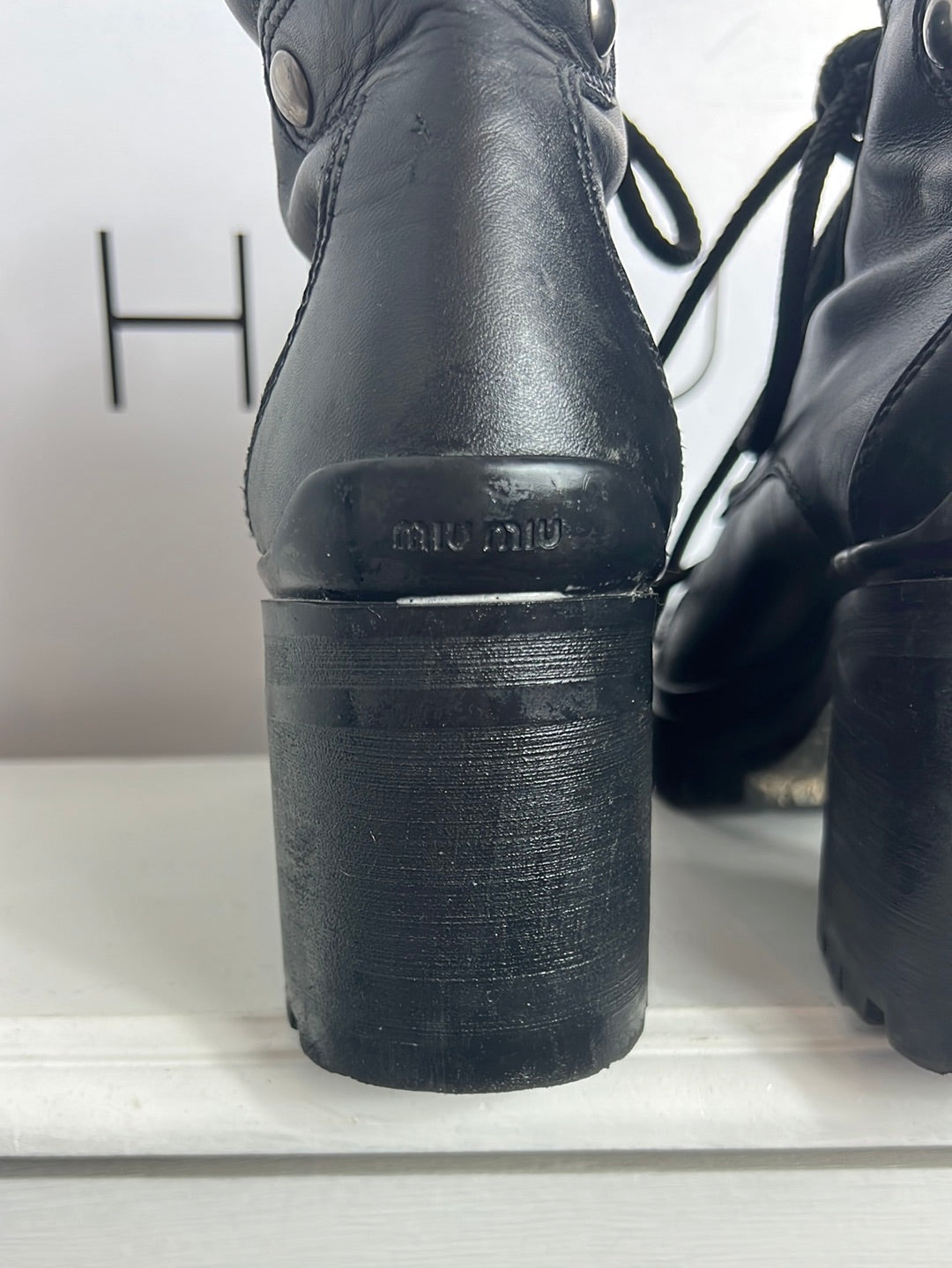 MIU MIU. Black lace-up heeled ankle boots. Size 39