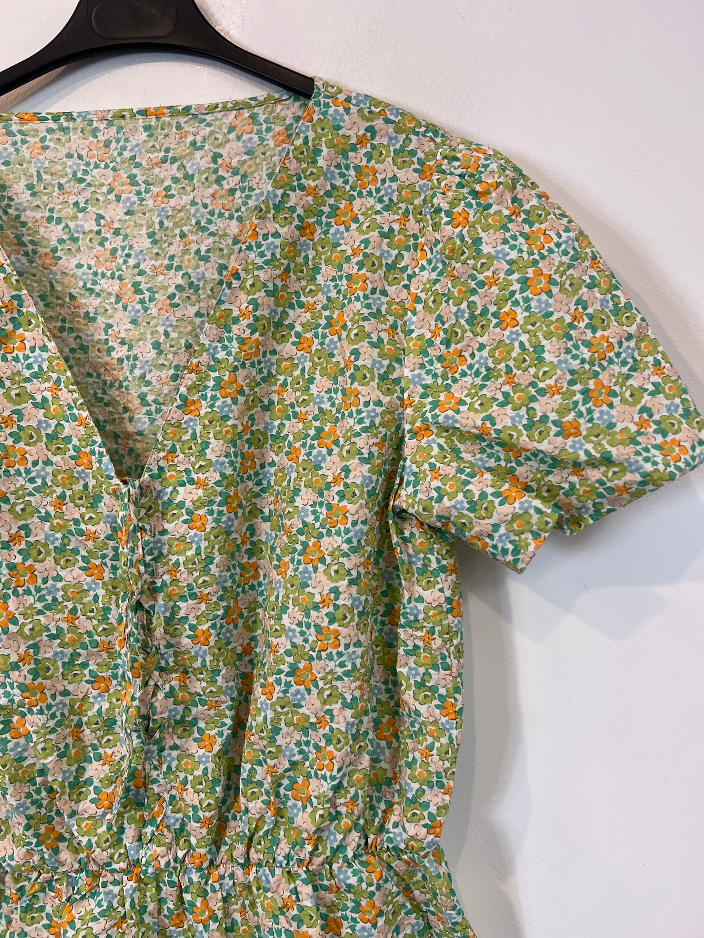 OTRAS. Mono corto flores TU(S)