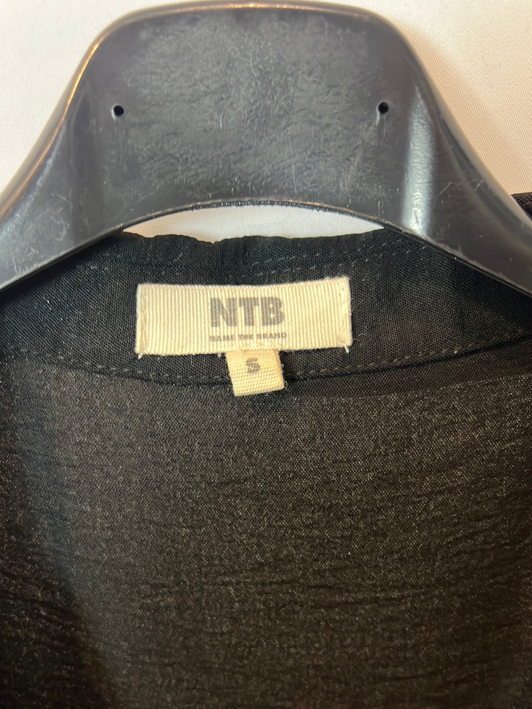 NAME THE BRAND. Black Ts bow dress