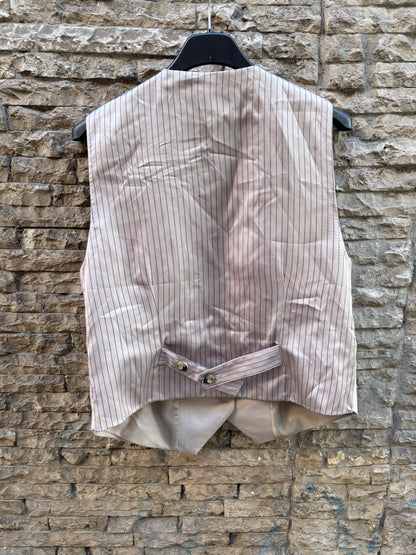 ZARA. Chaleco beige detalle espalda