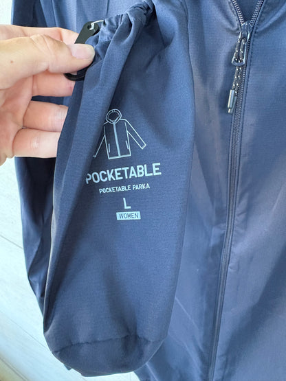 UNIQLO. Navy blue pocketable windbreaker. TL