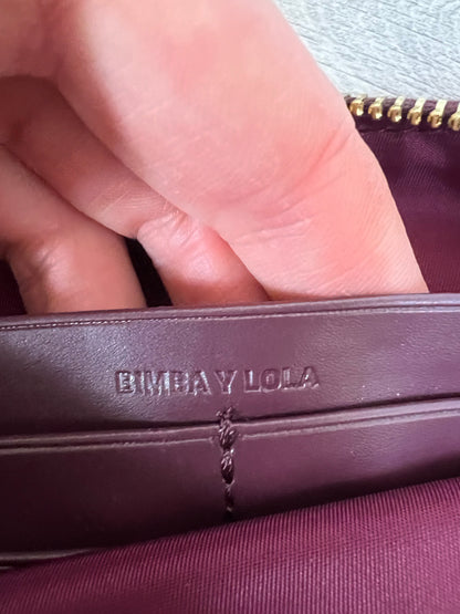 BIMBA Y LOLA. Cartera de mano burdeos