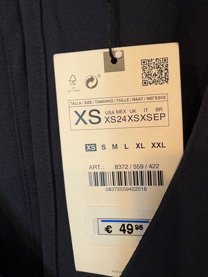 ZARA. Mono azul fluido escote