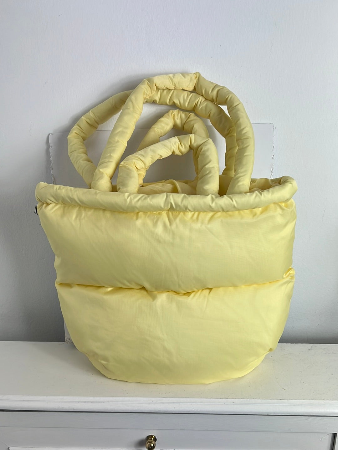 MADS NØRGAARD. Light yellow quilted bag