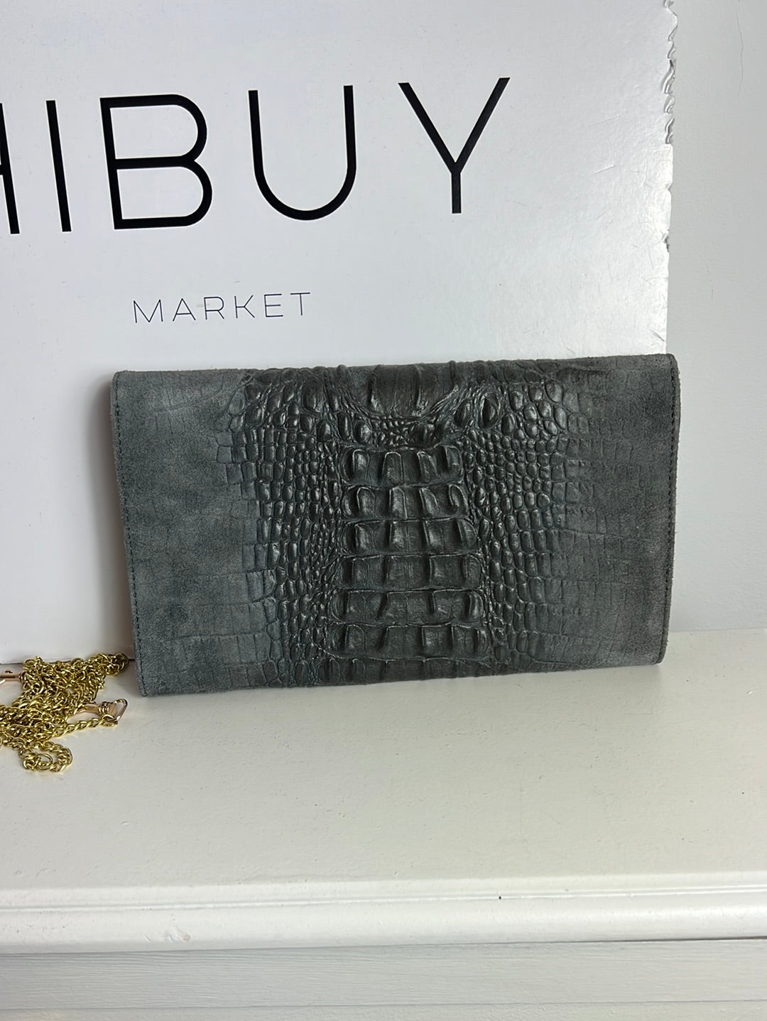 OTRAS. Bolso/cartera piel gris troquelada