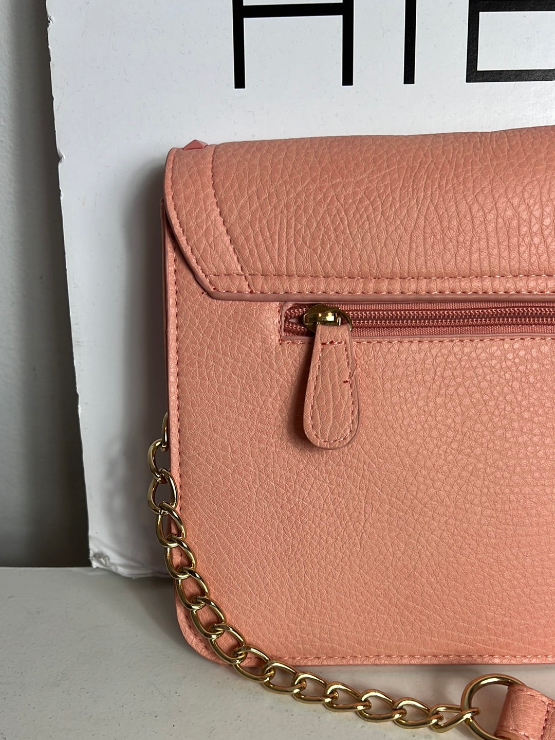 WHITE. Pink studded bag