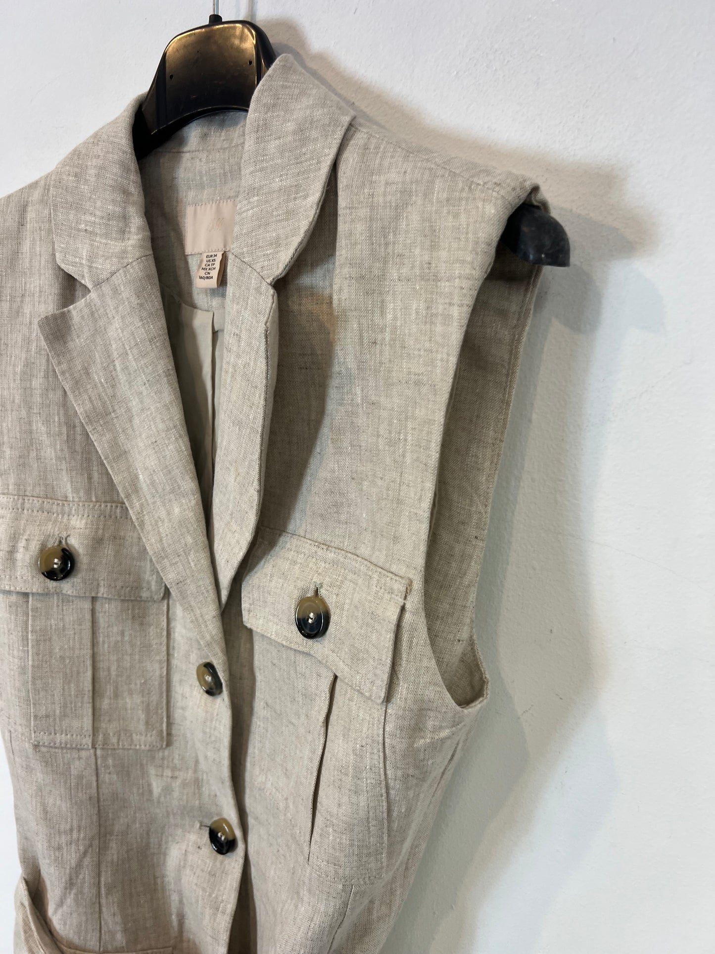 H&M. Chaleco lino bolsillos. T XS