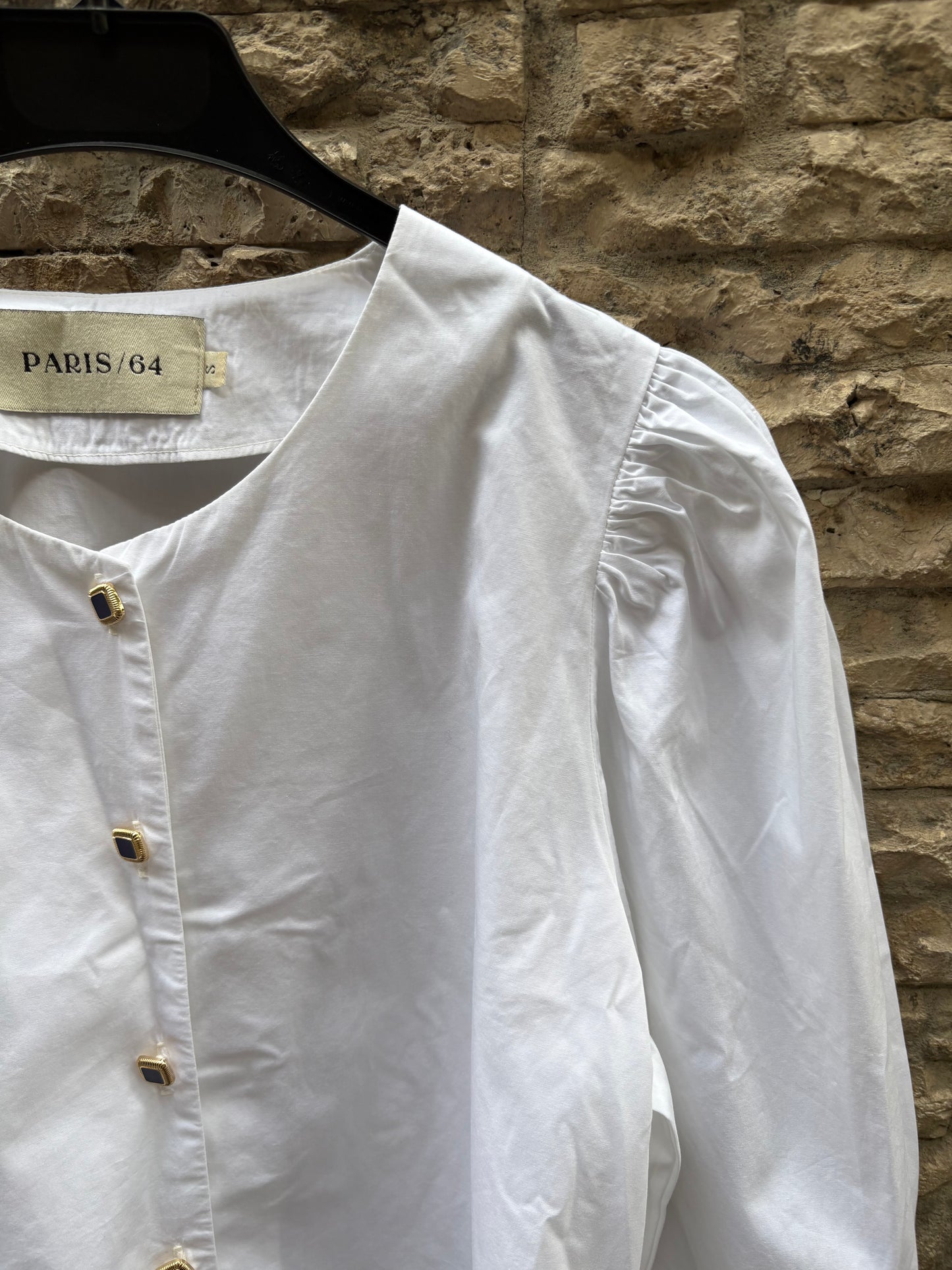 PARIS 64. White blouse with diamond buttons Ts