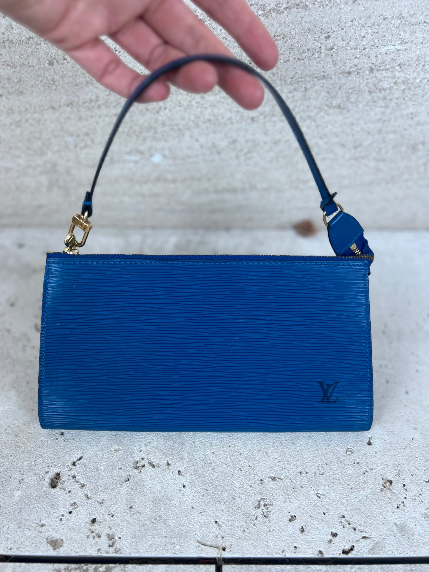LOUIS VUITTON. Blue leather clutch bag