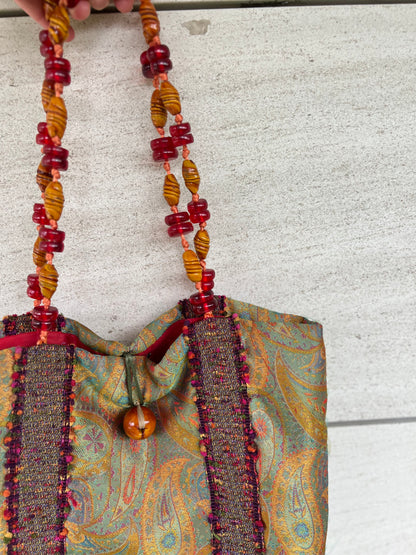 HELENE MENASCHE. Bolso estampado detalle asa