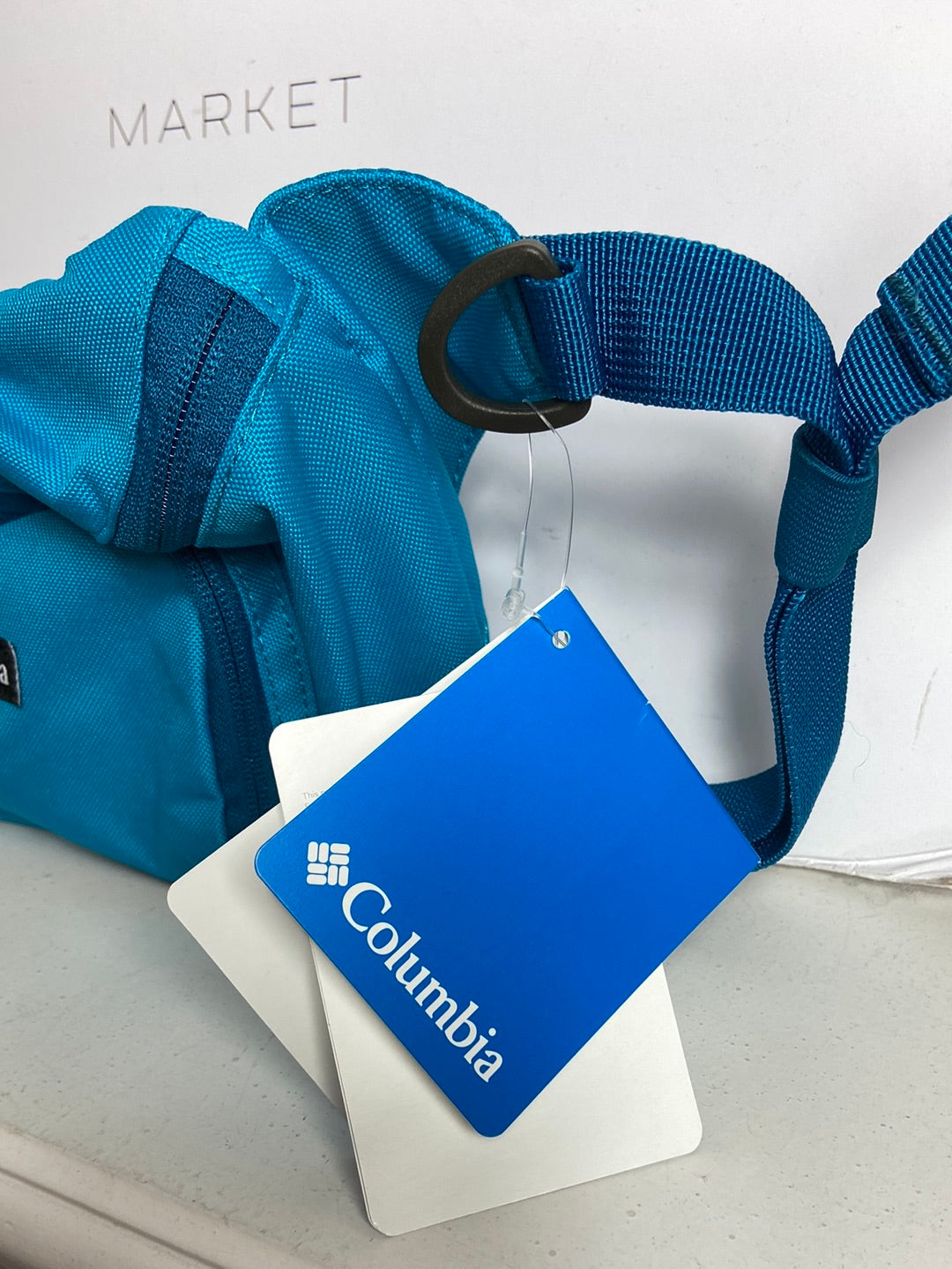 COLUMBIA. Riñonera azul logo T U