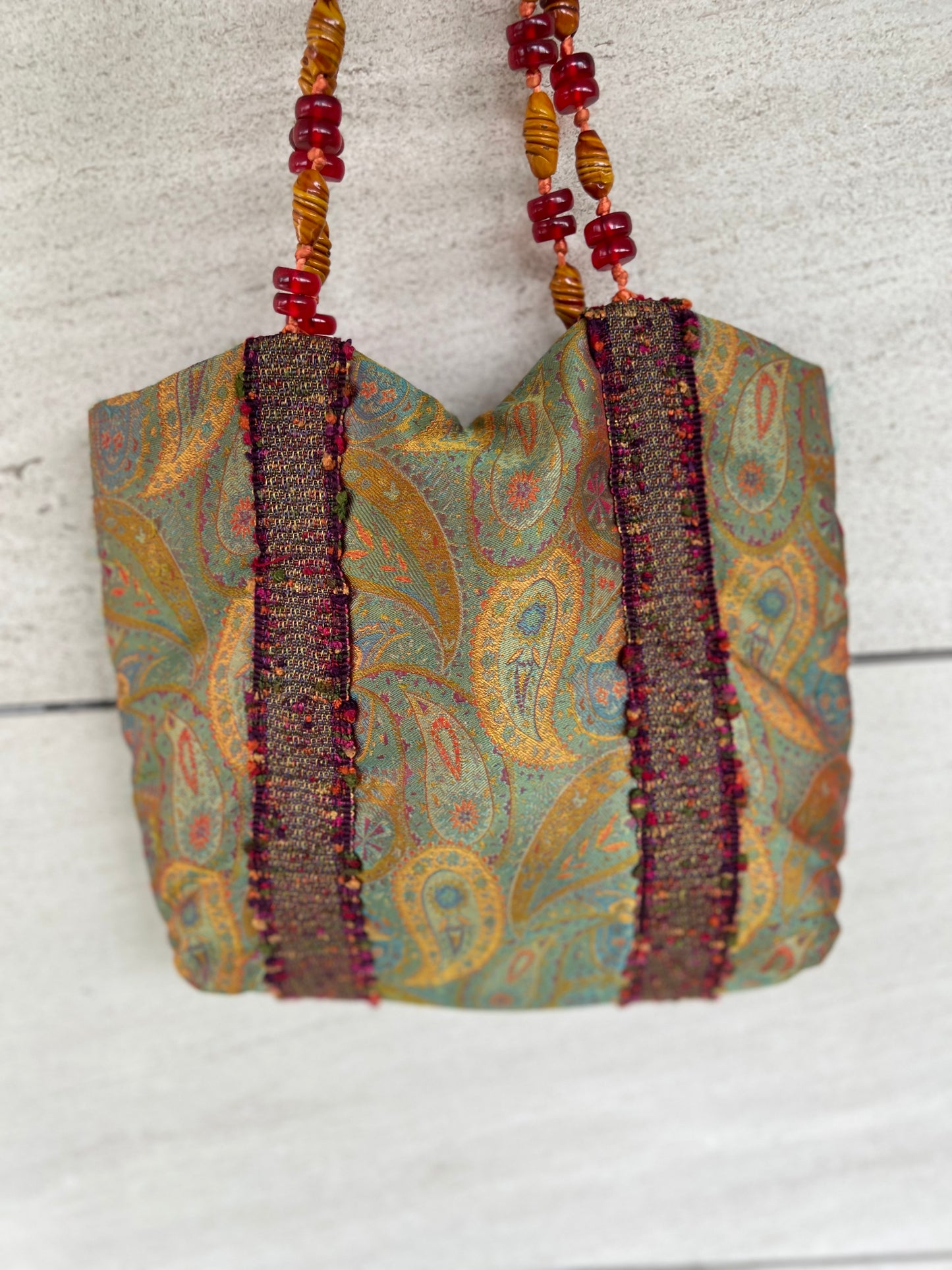 HELENE MENASCHE. Bolso estampado detalle asa