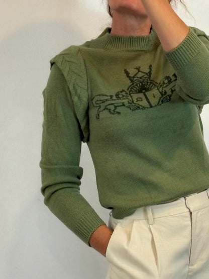 IQ. Jersey verde dibujo con lana