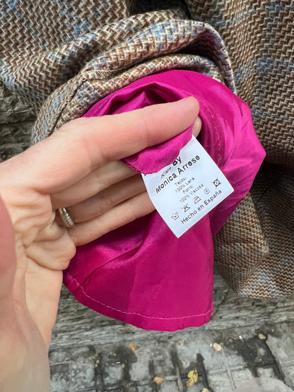 KIUT. Falda midi jaspeada lana