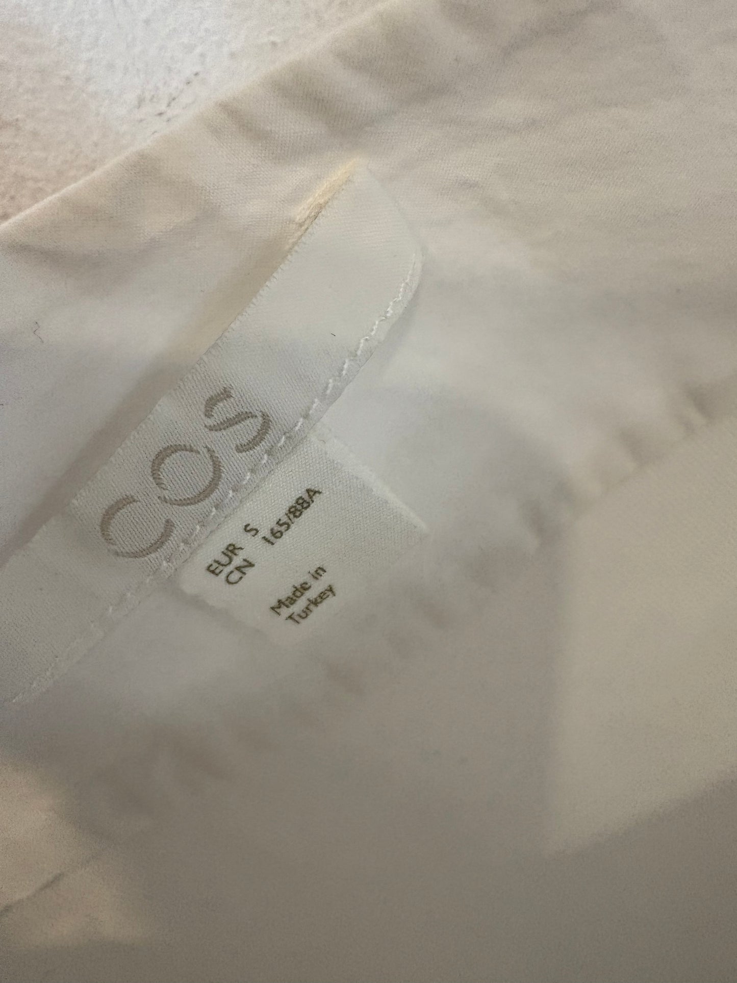 COS.Blusa asimétrica T.S