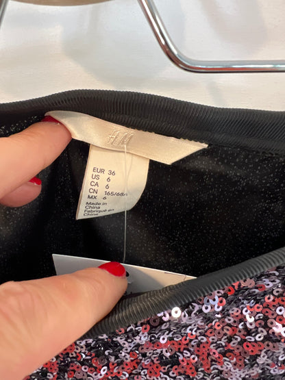 H&M. Falda midi lentejuelas T.36