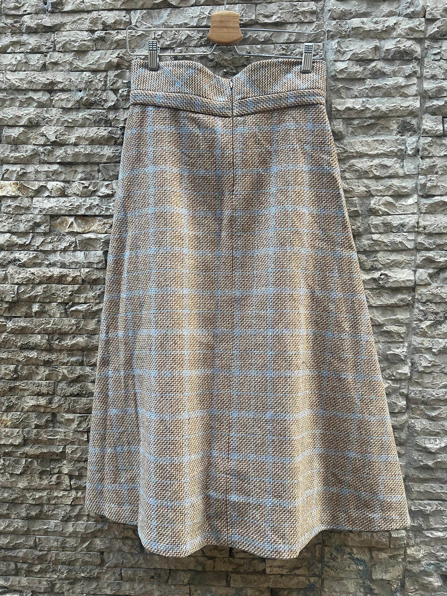 KIUT. Falda midi jaspeada lana