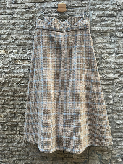 KIUT. Falda midi jaspeada lana