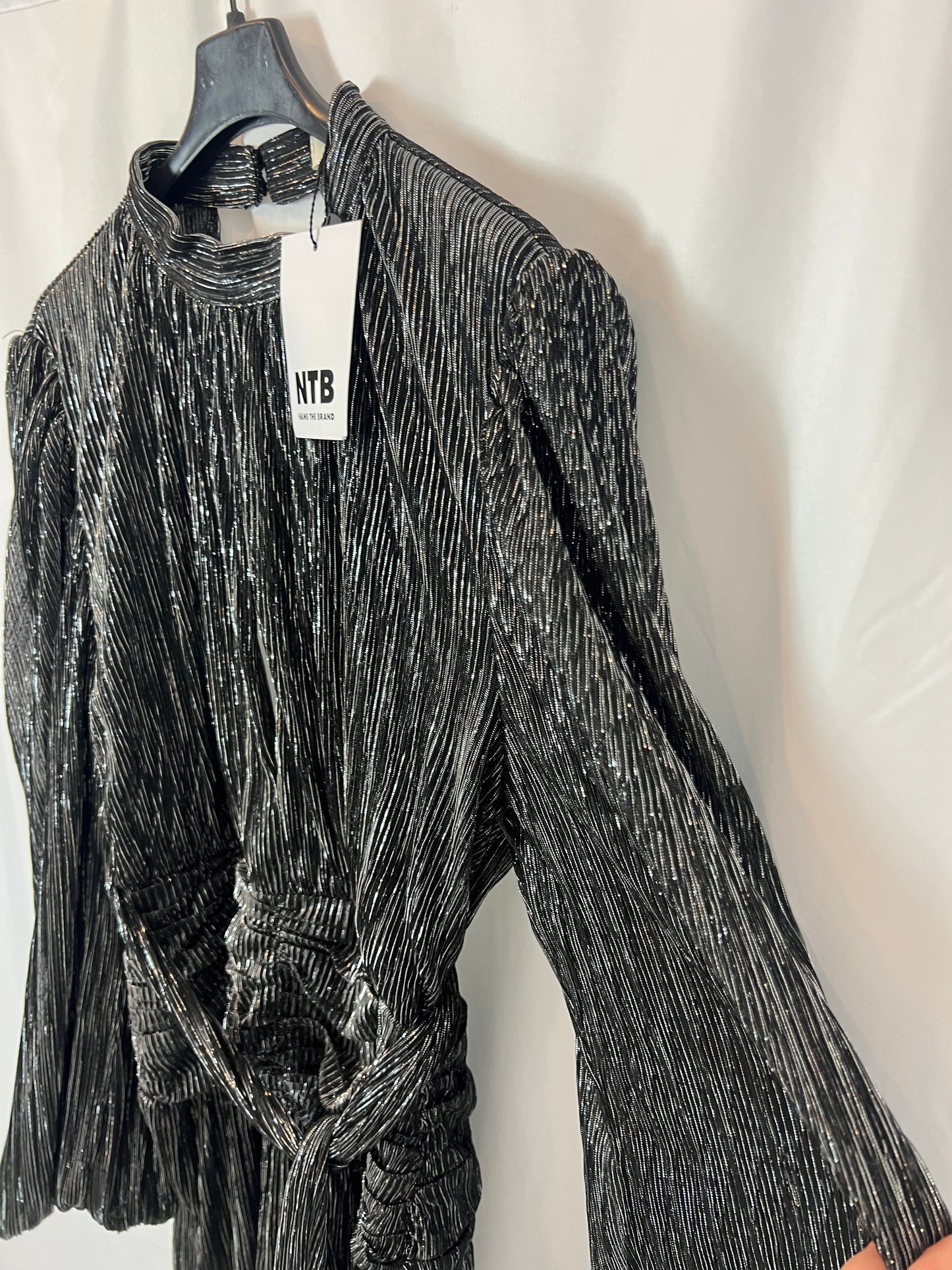 NAME THE BRAND. Short pleated dress with shiny threads. TS