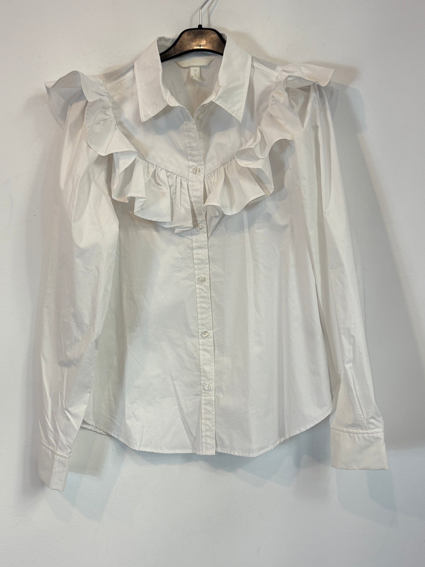 H&M. Camisa blanca volante. T S