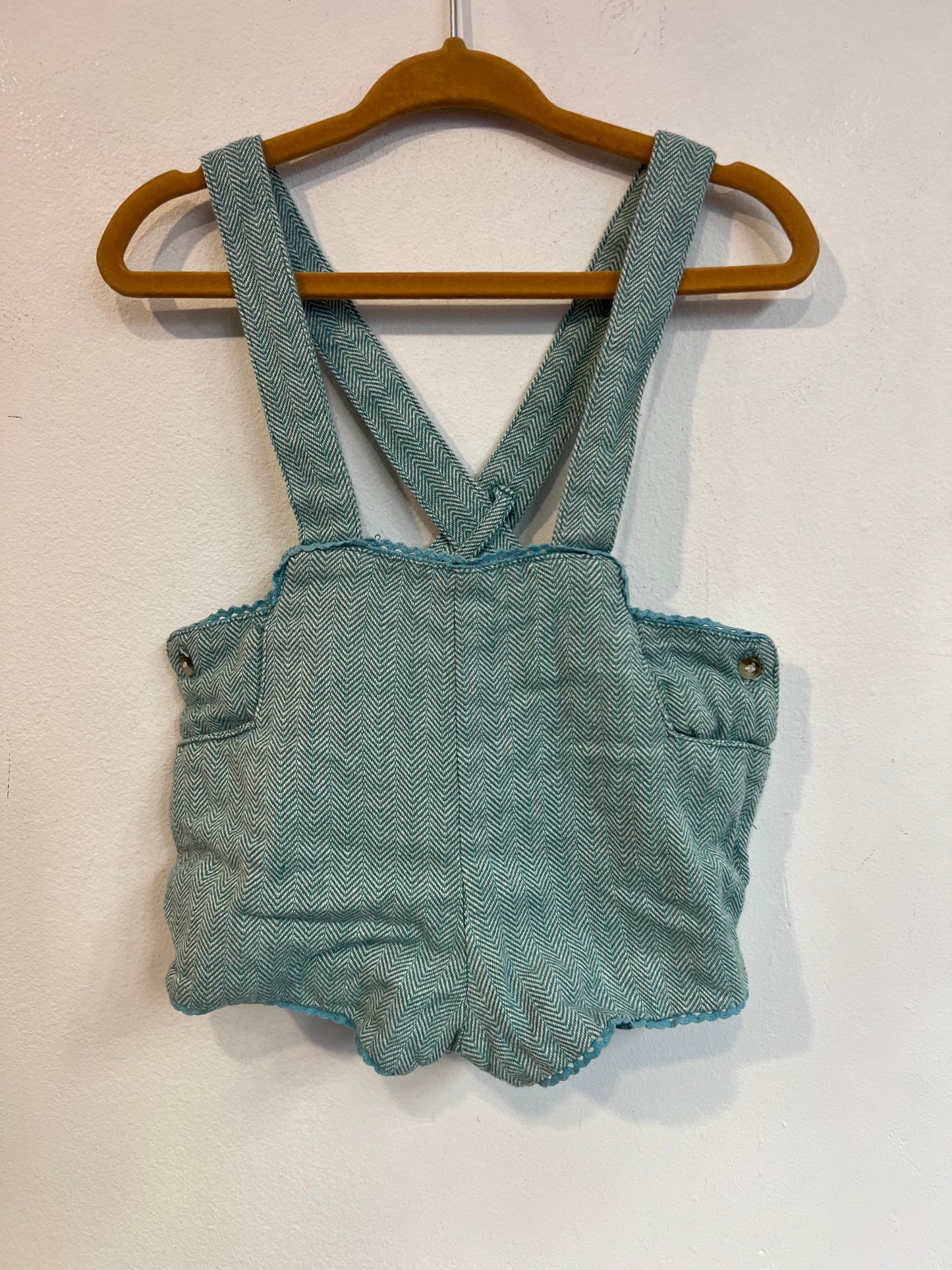 PATRICIA MENDILUCE. Ranita algodón azul claro jaspeado. T 12-18 meses