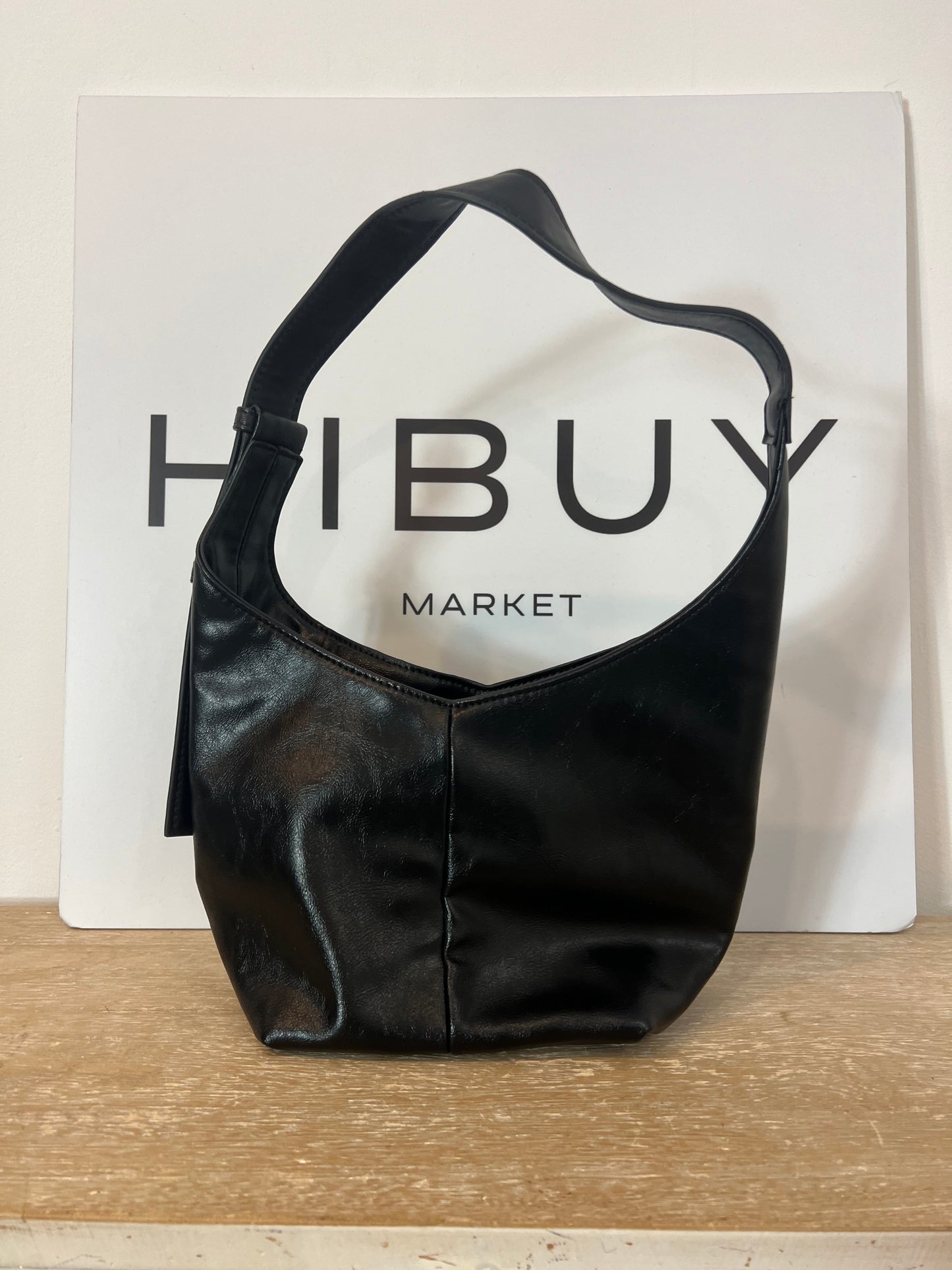 LEFTIES. Black faux leather bag