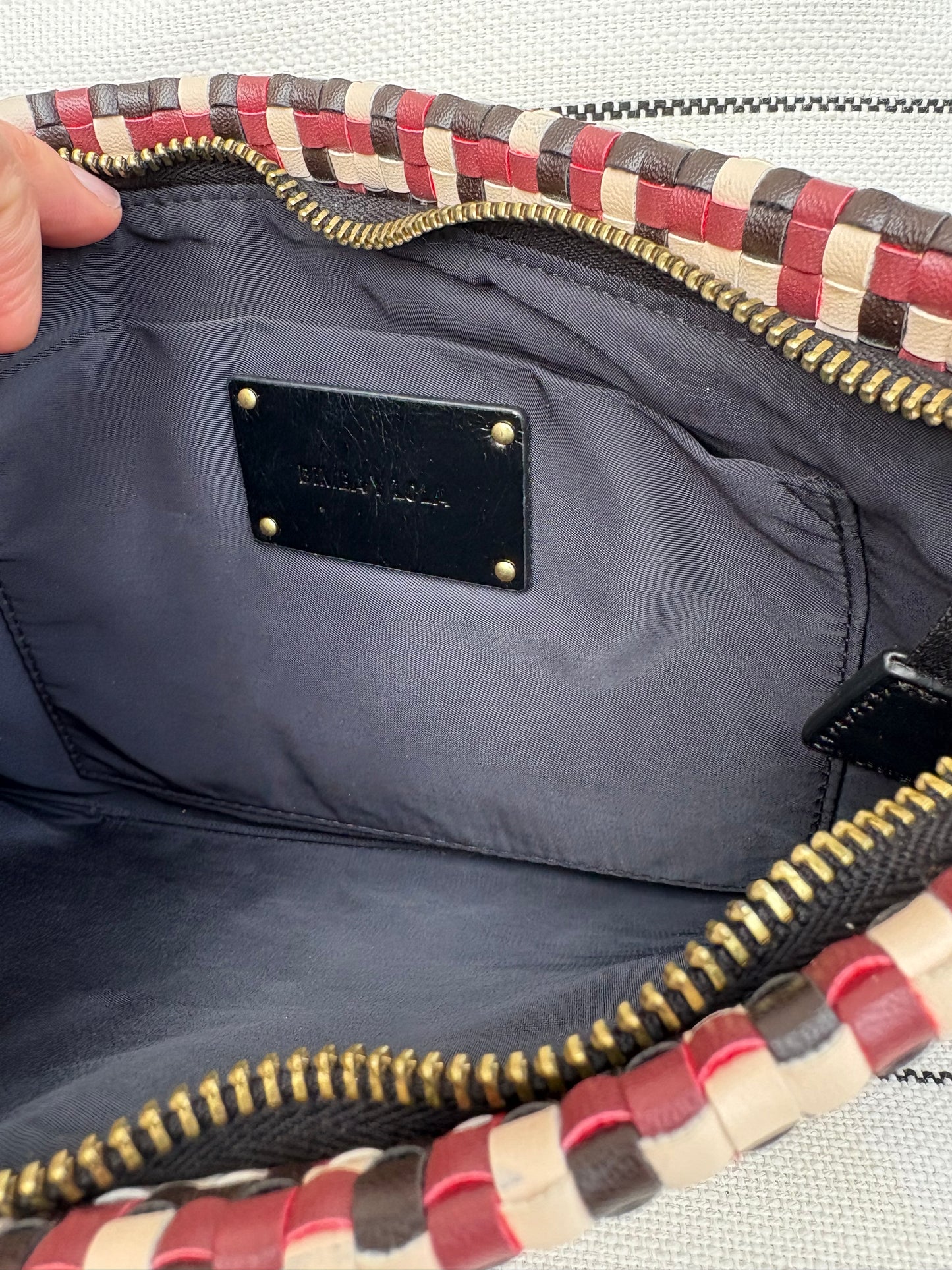 BIMBA Y LOLA. Cartera de mano trenzada