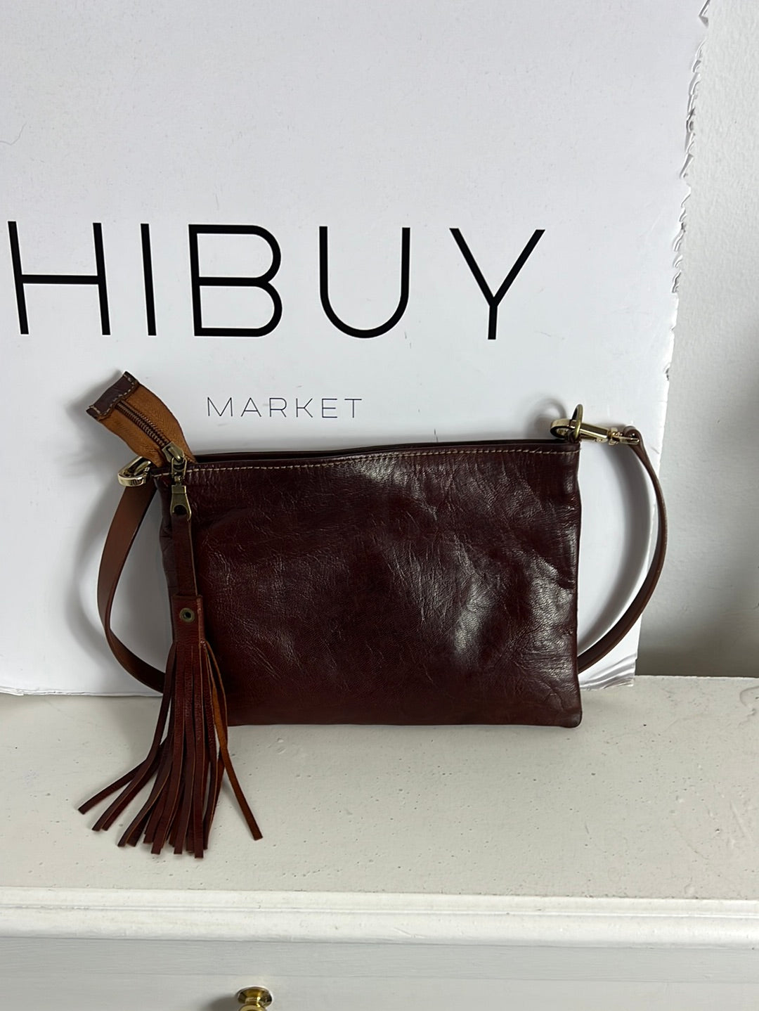 OTHERS. Brown leather bag with studs