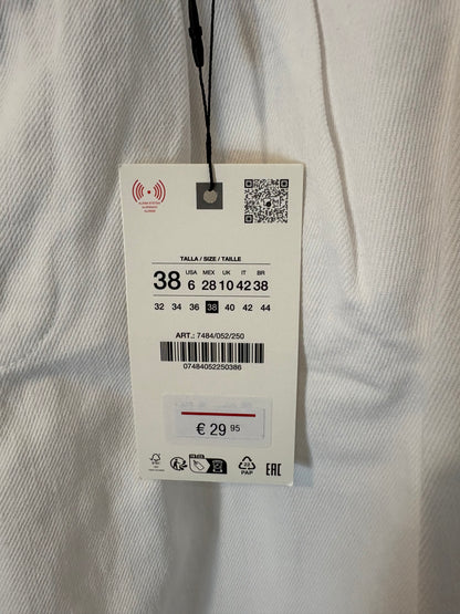 ZARA. Denim blanco ligero pata ancha. T 38