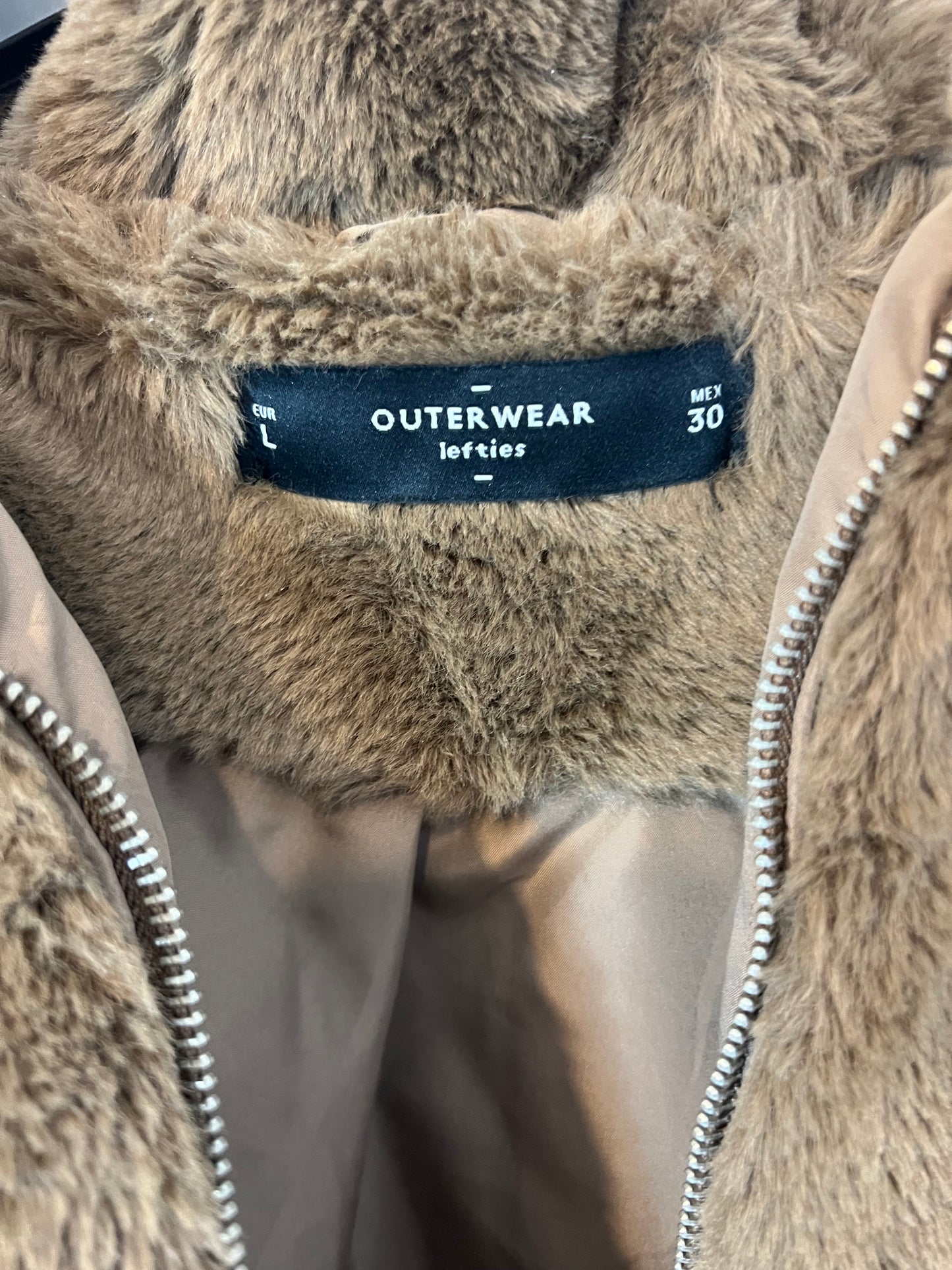 LEFTIES. Brown fur coat. T.L.