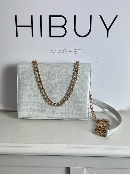 CUPLÉ. Bolso mini piel troquelado