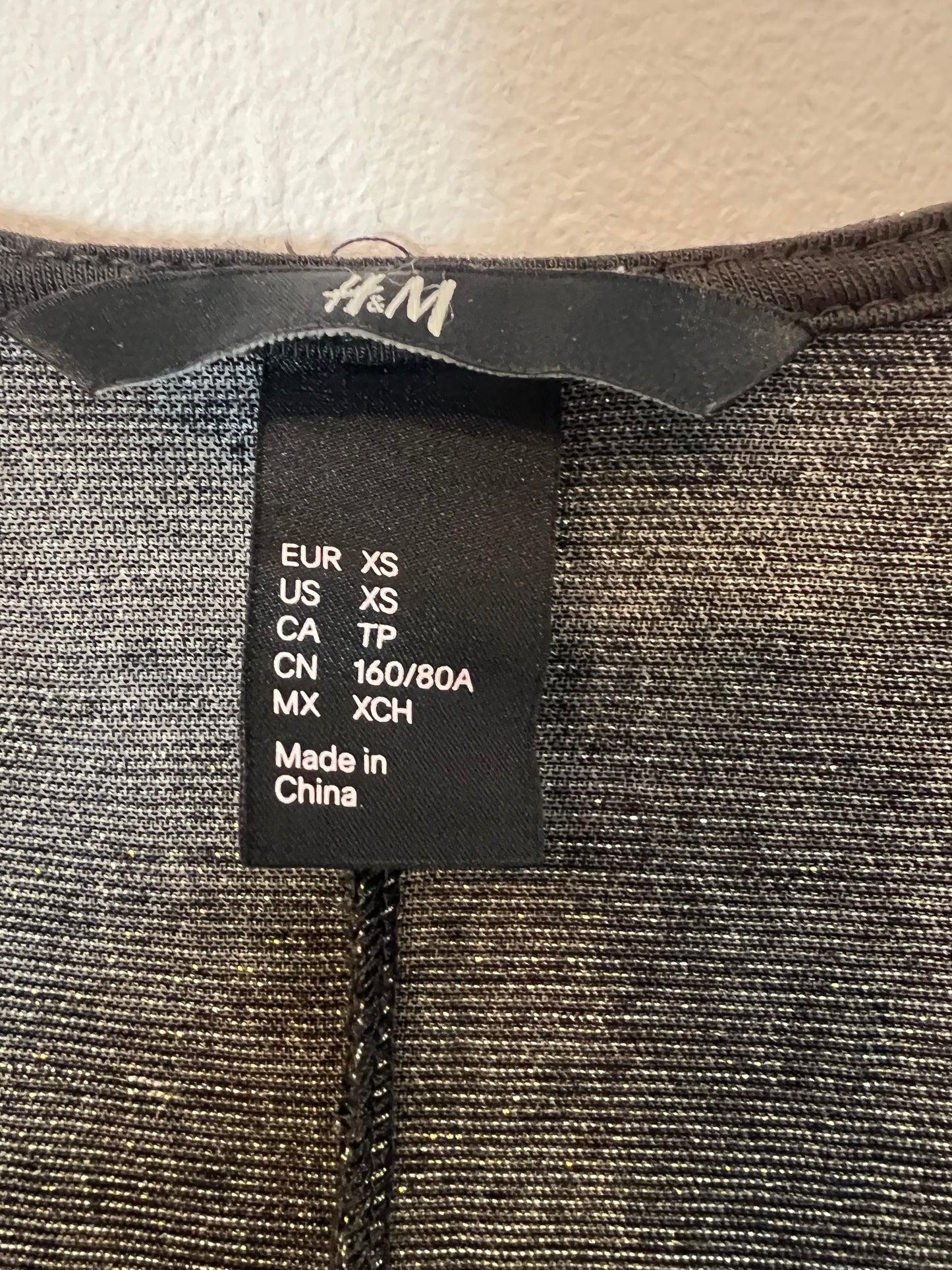 H&M. Chaqueta larga fluida hilos brillo. T XS