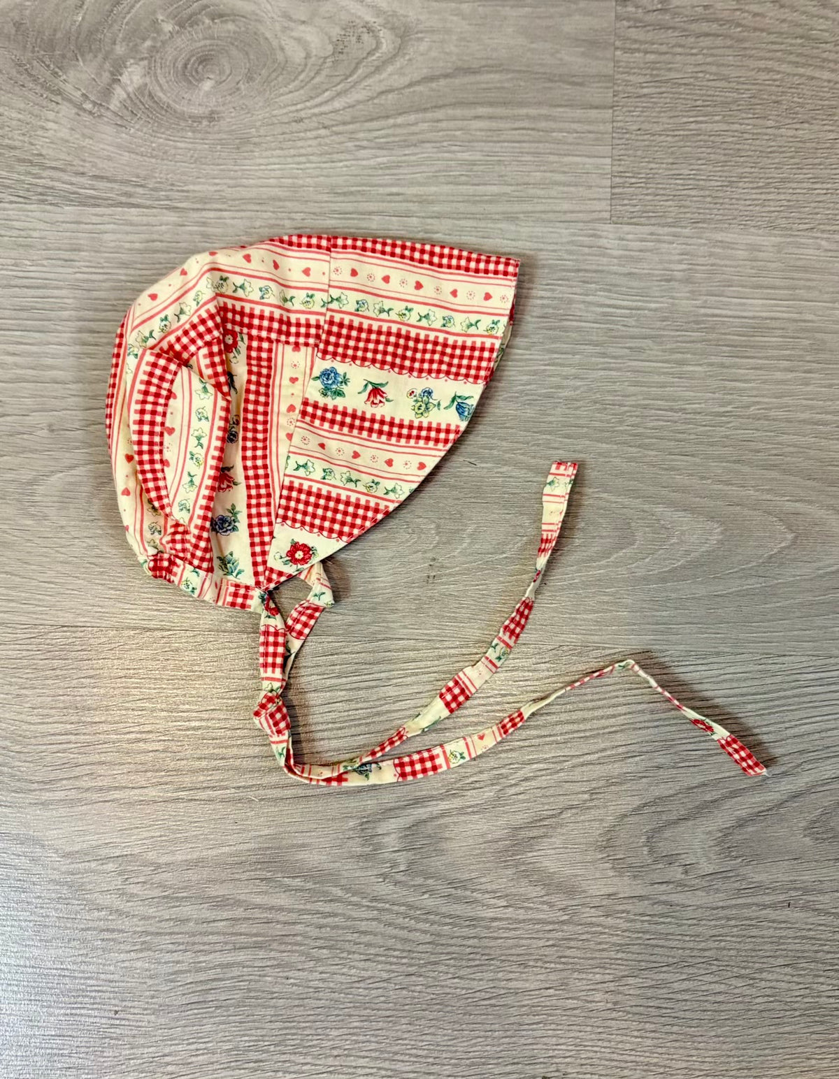 OMINI. Gorro/visera flores naranjas T. 3 meses