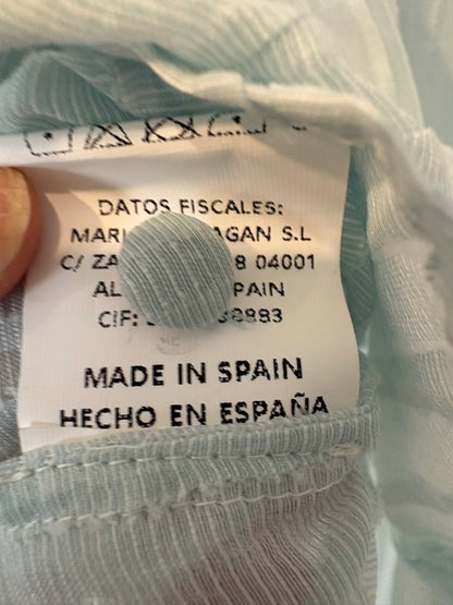 MARIA BARRAGÁN. Blusa azul claro textura lazada